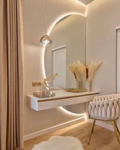 a white chair sitting in front of a mirror on top of a counter next to a table