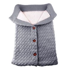 a dog sweater with buttons on the collar and sleeves, made from knitted material