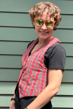 Fab vintage handmade vest in a bright red, green blue, black, white, and yellow plaid - great for adding a punch to an everyday outfit and for holiday parties!  Very good vintage condition with no marks or holes.  Approximate garment measurements laid flat (all measurements in INCHES): across shoulders: 10.5 across armpits: 17.5 front collar to bottom: 14   back collar to bottom: 22 across bottom: 17.5 Note that our shipping prices include tracking, insurance, and assume "worst-case" - i.e., to the West Coast from our East Coast shop - we refund overestimations on shipping as per our Shipping Policies.  We ship to most countries - convo us for combined or non-US shipping rates. For more fab vintage clothes and shoes, check out the rest of our shop:  https://grooveclothing.etsy.com  Follow Red Cotton Retro Vest, Red Retro Cotton Vest, Retro Red Cotton Vest, Fitted Plaid Cotton Vest, Fitted Red Retro Vest, Fitted Retro Red Vest, Retro Red Fitted Vest, Handmade Vest, Christmas Vest