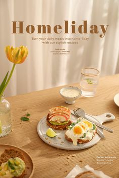 a plate with food on it sitting on top of a wooden table next to a vase filled with flowers