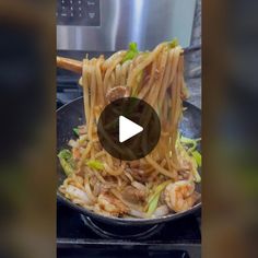 a pan filled with noodles and meat on top of a stove