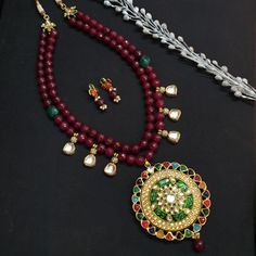 Indian Kundan Jewelry, Bollywood Jewelry, Navratan Stone Pendant Set, Wedding Designer Bridal Jewelry, Pakistani Jewelry, Latest Necklace The majestically handcrafted Kundan necklace set is the best to match Indian tradition and intricate work handcrafted by the artisans of India. The necklace is a masterpiece inspired by Indian jewelry to give you a royal look. The bold and bright design of the necklace is perfect for all the beautiful women * Necklace Length: 22 inches (comes with adjustable dori) * Earrings Length: 1 inch approx * Material: Brass and stone * Package: Necklace And Earring STYLE TIP: This piece of elegant jewelry goes well with all your modern as well as traditional outfits. Best match for your wedding outfits ABOUT US: Jaipri makes each piece of its product by learning t Kundan Necklace With Stone Work, Kundan Bridal Necklace With Hand Set Round Beads, Red Mala For Wedding Temple Jewelry, Bridal Necklace For Puja And Festivals, Traditional Bridal Necklace With Hand Set For Festivals, Traditional Heavy Bridal Necklace For Puja, Round Bridal Necklace For Puja And Festivals, Traditional Bridal Sets With Stone Work For Celebrations, Round Cutdana Bridal Necklace For Celebrations