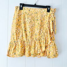 Cynthia Rowley Yellow Floral Highwaisted Ruffled Mini Wrap Skirt, Size Medium. New With Tags. The First Wrap Is Secured By A Button On The Right Side. The Second Is Wrapped Over And Tied On The Left Side. Great For The Summer! Pair Easily With A Cropped Top And Sandals. Material: 100% Rayon Measurements: 30in Waist | 18in Length Orange Floral Skirt, Leopard Pencil Skirt, Mini Wrap Skirt, Belted Mini Skirt, Flared Mini Skirt, Blue Mini Skirt, Wool Mini Skirt, Trumpet Skirt, Knit Pencil Skirt