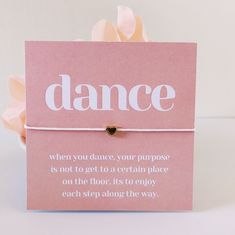 a pink card with the words dance on it