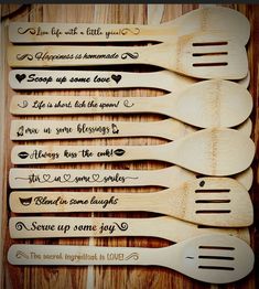 five wooden spoons with different sayings on them