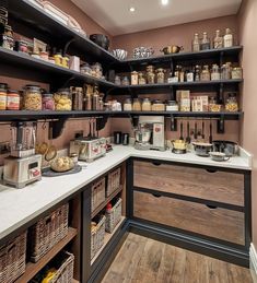 a kitchen with lots of shelves filled with food