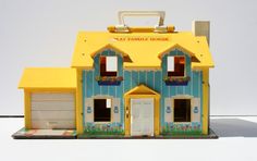 a yellow and blue toy house with two garages on the front, and one door open