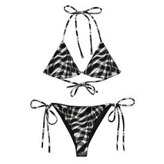 Stay comfortable and stylish all summer with this All-Over Print Recycled String Bikini set. It's made from soft recycled polyester with double-layering and UPF 50+. Style the straps how you like and get ready to swim!  * Soft and stretchy material with UPF 50+ * Sizes up to 6XL * Bikini top comes with removable padding for comfort * Multiple ways to tie and style the bikini set Disclaimer: To make your All-Over Print Recycled String Bikini last longer, thoroughly rinse it off after each use and get rid of any chlorine/salt residue. Black Triangle Top Swimwear For Vacation, Adjustable Beachwear Tankini For Vacation, Black Printed Festival Swimwear, Black Printed Beachy Swimwear, Adjustable Tankini For Beach Season, Adjustable Beachwear Swimwear For Vacation, Black Printed Tankini, Black Adjustable Swimwear For Poolside, Adjustable Black Swimwear For Poolside