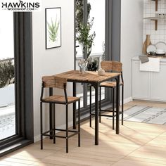 a kitchen table and chairs in front of a large window with potted plants on it