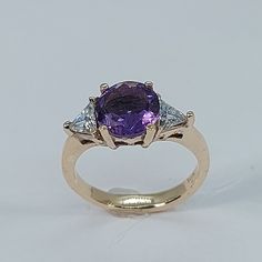 This stunning  style ring has been carefully crafted in warm 10k yellow gold , authentic amethyst and White Cubic Zirconia. Great for any occasion! Buy it for your-self or for someone you love! This beautiful ring will not go unnoticed. All of my jeweler is handmade from scratch and of high quality. A tracking shipping number will be provided to you once the ring has been mailed. Ring Measurements: Ring is size 5 1/2  but can be resized at no extra cost and will be shipped to you in an elegant g Purple Sapphire Ring With 14k Gold Prong Setting, Yellow Gold Amethyst Ring With Accent Stones, Round Cut, Yellow Gold Amethyst Ring With Round Cut Accent Stones, Amethyst Center Stone Birthstone Ring In Yellow Gold, 14k Gold Purple Sapphire Ring With Accent Stones, 14k Gold Ring With Purple Center Stone, Yellow Gold Amethyst Ring With Center Stone, Yellow Gold Birthstone Ring With Amethyst Center Stone, Purple 14k Gold Ring With Center Stone