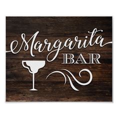 a wooden sign that says margarita bar with a wine glass on it and the word margarita written