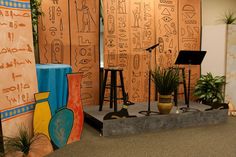 an egyptian themed stage set up with sound equipment