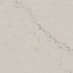 a white marble counter top textured with light gray veiners