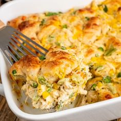 a close up of a casserole with a fork in it