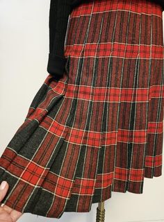 Tartan kilt stitched down pleats from the waist to hips, zipper worn side or back. Unlined   no label  wool fabric most likely  vintage from the 80's British made. Size 8 Waist 30" Hips  38" Length 26"  In excellent condition * Care Dry Clean Only   Photographed  with a black sweater  not available Fall Fitted Skirt With Box Pleat, Fitted Box Pleat Skirt For Fall, Vintage Fall Pleated Skirt, Vintage Pleated Skirt For Fall, Scottish Style Fitted Pleated Skirt For Fall, Fall Scottish Pleated Skirt, Vintage Full Pleated Skirt For Fall, Vintage Lined Skirt For Fall, Vintage Pleated Bottoms For Fall