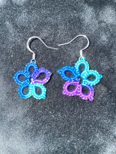 Tatted with a cotton thread on sterling silver earrings with a star floral motif in multiple colors. Made in Alaska Multicolor Flower Jewelry With Matching Earrings, Multicolor Flower Shaped Jewelry With Matching Earrings, Hypoallergenic Multicolor Flower Earrings, Multicolor Flower Jewelry Set With Matching Earrings, Adjustable Flower-shaped Jewelry For Crafting, Crochet Butterfly Earrings, Handmade Star-shaped Multicolor Jewelry, Bohemian Multicolor Star-shaped Jewelry, Handmade Multicolor Star-shaped Jewelry