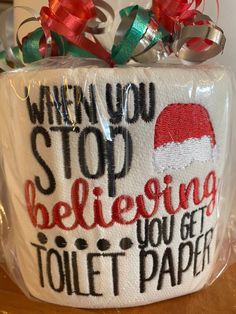 a toilet paper bag that has been decorated with santa's hat and the words when you stop believing, you get toilet paper