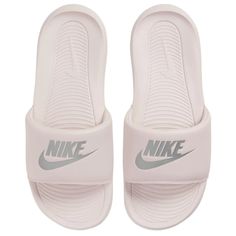 A new take on a classic design, the Nike Victori One Slide is perfect for spring and summer. Soft foam, a contoured footbed, and a comfy padded strap ensure all-day comfort. Padded strap provides a better fit and a comfortable feel. Rolled top edge on the strap feels smooth. Softer foam underfoot ensures all-day comfort. Contoured footbed delivers the supportive feel you need with every step. Outsole has a new pattern that gives better traction. Pink Nike Slides, Slides Nike, Nike Flip Flops, Nike Slippers, Nike Sandals, Pink Slides, Nike Slides, Slides Women, Pink Nikes