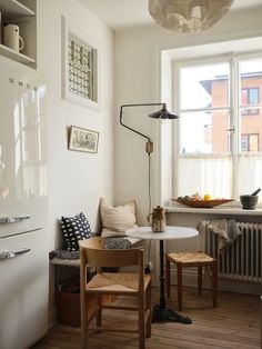 a small table and chairs in a room