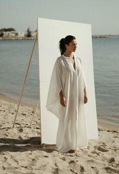 Gaia Linen Dress in White Chic White Maxi Length Cover-up, Chic White Maxi Dress For Loungewear, Elegant White Kaftan For Daywear, Elegant Spring Kaftan For Loungewear, White Relaxed Fit Maxi Dress For Loungewear, White Flowy Maxi Dress For Loungewear, Elegant Spring Kaftan For Beach Cover-up, Chic Oversized White Maxi Dress, Elegant White V-neck Kaftan