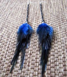 "These earrings were crafted using blue saddle feathers, black glass beads and black aluminum chain. About 8\" in length from the top of the surgical steel ear wires to the bottom of the feathers. Made to order. Please see my shop policies or shop announcement for current turn around time. If you need your order asap please let me know, I can usually accommodate rush orders. Check out the huge selection of feather jewelry and accessories in my shop! Please feel free to contact me for a custom or Adjustable Black Feather Jewelry, Black Feathered Jewelry For Festivals, Black Feather Jewelry For Party, Black Feathered Jewelry For Party, Elegant Blue Feather Earrings, Adjustable Blue Feather Earrings, Blue Feather Earrings For Gift, Blue Feather Earrings As Gift, Blue Feather Earrings Gift