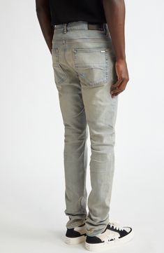 Slim-fitting jeans are made in Los Angeles from comfortable stretch denim with definite rock-star appeal. 34" inseam; 10" leg opening; 10" front rise; 14" back rise (size 29) Button fly Five-pocket style 92% cotton, 6% elastomultiester, 2% elastane Dry clean Made in the USA Men's Designer Clothing Fitted Faded Jeans In Rigid Denim, Fitted Faded Jeans For Streetwear, Light Wash Fitted Urban Jeans, Fitted Light Wash Urban Jeans, Urban Style Light Wash Fitted Jeans, Urban Style Fitted Light Wash Jeans, Light Wash Fitted Jeans, Distressed Fitted Rigid Denim Bottoms, Faded Fitted Tapered Leg Jeans