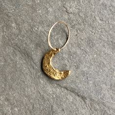 A crescent moon charm dangles from a lightly hammered jump ring. Add your celestial charm to your birthstone cluster necklace. Length 3/4" Width 1/2" Stamp upto 1 character on full moon charm Our crescent moon, star, full moon and ellipse charms are available in brass and sterling silver. Pair with a brass or sterling silver chain and birthstone charm. Each charm is sold separately. Brass Moon Charm Jewelry, Nickel Free Crescent Celestial Jewelry, Celestial Moon-shaped Hand Forged Jewelry, Nickel-free Celestial Crescent Jewelry, Hand Forged Moon Shaped Celestial Jewelry, Hammered Moon-shaped Jewelry As Gift, Hammered Moon-shaped Jewelry For Gifts, Nickel-free Crescent Celestial Jewelry, Hammered Half Moon Jewelry As A Gift