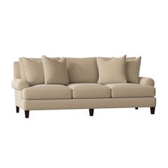 an image of a couch with pillows on the top and bottom part in beige color