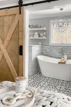 a bath room with a tub and a wooden door