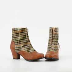 1940's Inspired Front Zip City Boot. Not Your Average Boot, This Stylish City Boot Is Sure To Take You On The Most Perfect Adventures. Proud To Be 100% Vegan Friendly. Upper Material: Faux Textured Leather + Laminated Plaid Lining Material: Man Made + Fabric / Sock Padded With Memory Foam For Comfort. Shaft Height: Measurements From Back Counter Where Heel Starts To Top Of Shaft (based on a size 6 shaft) 4 1/8" Inches Approximate Heel Height: 2 3/8" Inches Step In / Front Zipper Closure. Fit: Tr Retro High Heel Winter Boots, Retro High Heeled Winter Boots, Retro High-heeled Winter Boots, Retro High Heeled Boots For Winter, Retro Ankle Boots For Winter, Retro Brown Ankle Heeled Boots, Retro Fall Heeled Boots, Retro Heeled Boots For Fall Formal Events, Retro Heeled Boots For Formal Fall Occasions