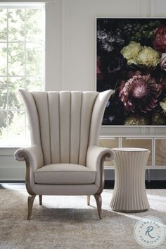 an elegant chair and side table in a living room