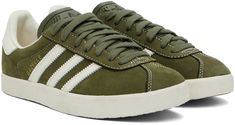 Low-top suede sneakers in khaki. Buffed leather trim throughout. · Lace-up closure · Logo embossed at tongue and heel tab · Padded collar · Signature serrated stripes at sides · Grained leather lining · Treaded rubber sole Supplier color: Olive strata/Chalk white Chalk White, Original Clothes, Suede Sneakers, Leather Trim, Luxury Streetwear, Leather Trims, Low Top, Adidas Originals, Top Sneakers