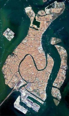 an aerial view of the water and land in venice, italy photo by nasa imagery