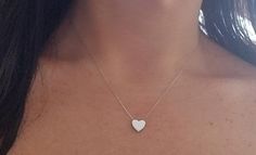 14K SOLID WHITE GOLD HEART NECKLACE Here is a dainty, delicate and simple, yet classy minimalist Heart Necklace.This is a 14k Solid White Gold open back heart necklace. (We do not sell filled or plated jewelry) Perfect for everyday use. Also available in 14k Yellow Gold. https://www.etsy.com/listing/749228903/14k-yellow-gold-heart-necklace?ref=listings_manager_grid Metal : 14K Solid Gold Necklace Length : 17 inches / 42.5cm Pendent Height : 9.10mm Pendant Width : 10.00mm Shipping Policy Item wil White Gold Heart Necklace, Yellow Gold Heart Necklace, Dainty Heart Necklace, Engraved Heart Necklace, Classy Minimalist, Tiny Heart Necklace, Solid Gold Necklace, Gold Heart Necklace, Necklace Minimalist