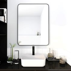 a bathroom sink with a mirror above it and a shelf below the sink in front of it