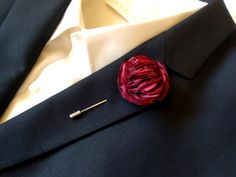 Boutonnière Burgundy lapel pin Suit brooch . This is listing for lovely Silk flower on lapel pin. Every petal of the flower is hand made by me and they are assembled together to form a very charming flower.  Elegant flower Boutonnière for special occasions. The size of the flower is about 4 cm. /1,75 inches/ .  If you want some different size of the flower, let me know and I will make a Custom order for you. You can buy 1 or set of 3,5,7 or 10.  More lapel pins: https://www.etsy.com/shop/LiLaGar Elegant Formal Brooches With Handmade Flowers, Red Flower Lapel Pin For Wedding, Elegant Handmade Flower Lapel Pin For Weddings, Elegant Handmade Flowers Lapel Pin For Weddings, Elegant Wedding Lapel Pin With Handmade Flowers, Elegant Flower Decoration Lapel Pin As Gift, Elegant Wedding Pins With Handmade Flowers, Flower Lapel Pin Brooch For Wedding, Flower Lapel Pin For Weddings