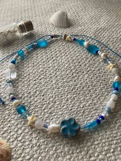 Mermaid Shores is a chunky beaded necklace strung on wax cord. It is adjustable and while water resistant, is not waterproof. Summer Beaded Necklace, Teen Summer Style, Ocean Necklace, Diy Collier, Bead Sewing, Beaded Necklace Diy, Beach Necklaces, Ocean Jewelry, Handmade Jewelry Tutorials