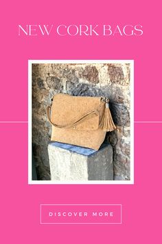 the new cork bag is on display in front of a brick wall and pink background