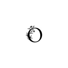 a black and white photo of the letter o with flowers on it's side