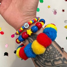 Clown pom pom beaded bracelet set clowncore accessories jewelry primary  Handmade clown bead bracelet set of 3 with chunky pom Pom bracelet and handmade fimo clay clown bead  ** CLOWN BEAD MAY CHANGE TO HAPPY FACE BEAD DEPENDING ON Availability! Perfect accessories to any fun outfit! Or cosplay  Tags;clown birthday party circus rave kidcore weird weirdcore kandi Cheap Playful Costume Accessories For Gifts, Funny Clown Gifts, Kandi Bracelet Sets, Clowncore Jewelry, Clowncore Accessories, Clowncore Kandi, Bracelet Kidcore, Clown Kandi, Clowncore Outfit