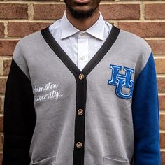 "Make a bold statement and wear your Hampton pride with this one-of-a-kind and comfortable cardigan sweater, perfect for any alumni, students or supporters. Made with the highest quality materials, this sweater is designed to keep you warm and cozy while representing Hampton. Features: - Official Hampton University logo embroidered on the chest - Large \"HU\" Logo Chenille patch - Classic cardigan design with a tortoise shell button-up front - Two front pockets (deep enough to fit a phone and other essentials) - Soft and durable fabric for long-lasting comfort - Available in a range of sizes to fit everyone - Versatile and fashionable, perfect for both casual and formal occasions Discover More Officially licensed Hampton University Apparel Celebrating Black excellence. Building legacy. Joi Varsity Cardigan For Winter College Season, Collegiate Long Sleeve Cardigan For College, Hampton University Apparel, Womens Varsity Cardigan, Varsity Cardigan, University Apparel, Hampton University, Chenille Patch, University Logo