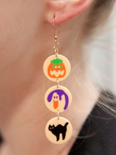 Introducing our Bite of Nostalgia Retro Halloween Cookie Earrings – the perfect blend of spooky and sweet, designed for those who love a touch of vintage charm. Crafted with care, these earrings are a delightful nod to classic Halloween treats, reminiscent of the cookies that filled your childhood memories. The attention to detail is impeccable, ensuring that these earrings capture the essence of nostalgia with every wear. Our Bite of Nostalgia earrings feature hooks made from stainless steel, e Halloween Cookie Earrings, Halloween Earring Ideas, Cute Halloween Party Jewelry, Halloween Novelty Drop Earrings, Halloween Novelty Drop Earrings Jewelry, Cute Halloween Earrings For Pierced Ears, Novelty Drop Earrings For Halloween, Vintage Halloween Dangle Jewelry, Spooky Hypoallergenic Jewelry For Halloween