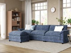 a living room with a blue sectional couch