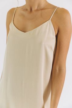 Design Details Care Size & Fit This strappy slip dress has been a best selling style for years - and for good reason! It has a relaxed fit and is made in our luxuriously soft, lightweight and eco-friendly TENCEL™. Layer it over a turtleneck while it's still cold, then wear it with sandals and a jean jacket once the weather warms up. Machine wash cold or up to 86° F / 30° C Hang dry or tumble low heat Dry Clean Optional True to size fit, take your normal size 100% TENCEL™ Modal Vegan Non-toxic, A Minimalist Fashion Chic, Boyfriend Shirt Dress, Female Founders, Vegan Fashion, French Seam, Boyfriend Shirt, A Hero, Sustainable Clothing, Silk Dress