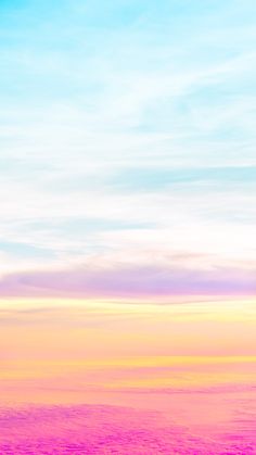 an airplane is flying in the sky at sunset or sunrise with pink and blue hues