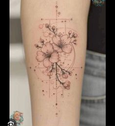 a woman's leg with flowers on it and a cross in the middle,