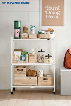 a white shelf filled with boxes and containers