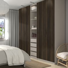 a bedroom scene with focus on the bed and cupboards