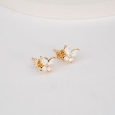 Mariposa Embrace springtime elegance with these captivating Marquise Diamond Butterfly Studs. Crafted in lustrous 14k yellow gold, these earrings feature delicate butterfly silhouettes adorned with shimmering marquise-cut diamonds. The marquise diamonds' elongated shape adds a touch of sophistication, while the butterfly motif injects a touch of whimsy. - Handmade- Solid Gold- Natural Diamonds - G Color, SI Quality Diamonds- Size of Butterfly: 6 x 7 mm- Total Diamond Carat Weight: 0.36 ctw All p Butterfly Motif, Delicate Butterfly, Diamond Butterfly, Marquise Cut Diamond, Diamond Carat, Marquise Diamond, The Butterfly, Marquise Cut, Diamond Sizes