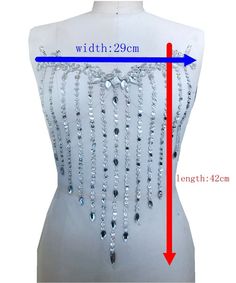 the measurements of a dress with beads on it and an arrow pointing to the waist